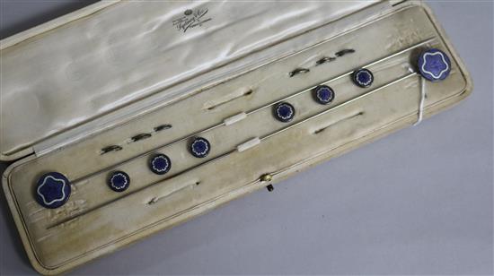 A cased set of early 20th century silver mounted and enamel hair pins and buttons (incomplete).